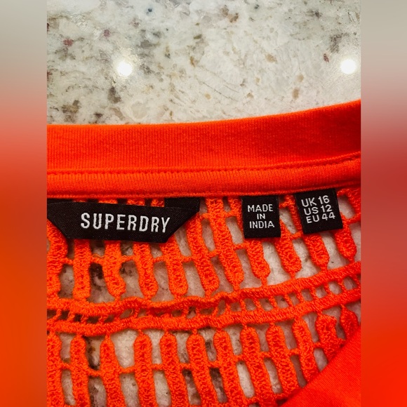 Orange sleeveless dress with crochet back. It’s a fitted dress - Picture 5 of 6